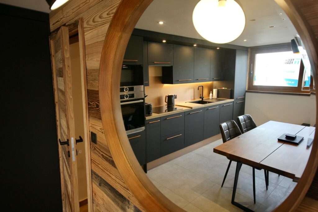 Le Petit Cham – Open Plan Kitchen & Dining Le Petit Cham apartment open plan kitchen and dining area with wood features