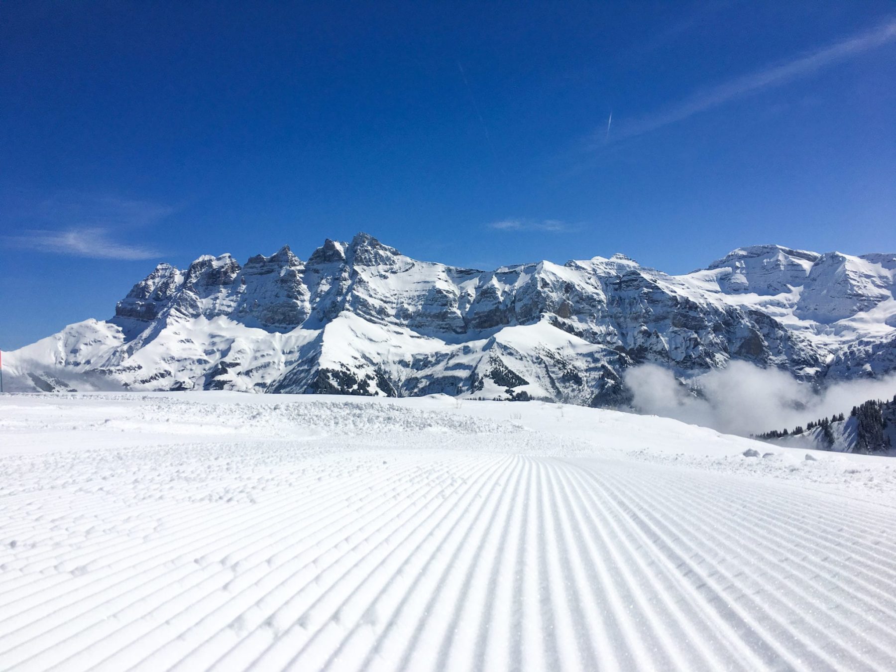 Fresh groomed snow with the Dents Du Midi in the background