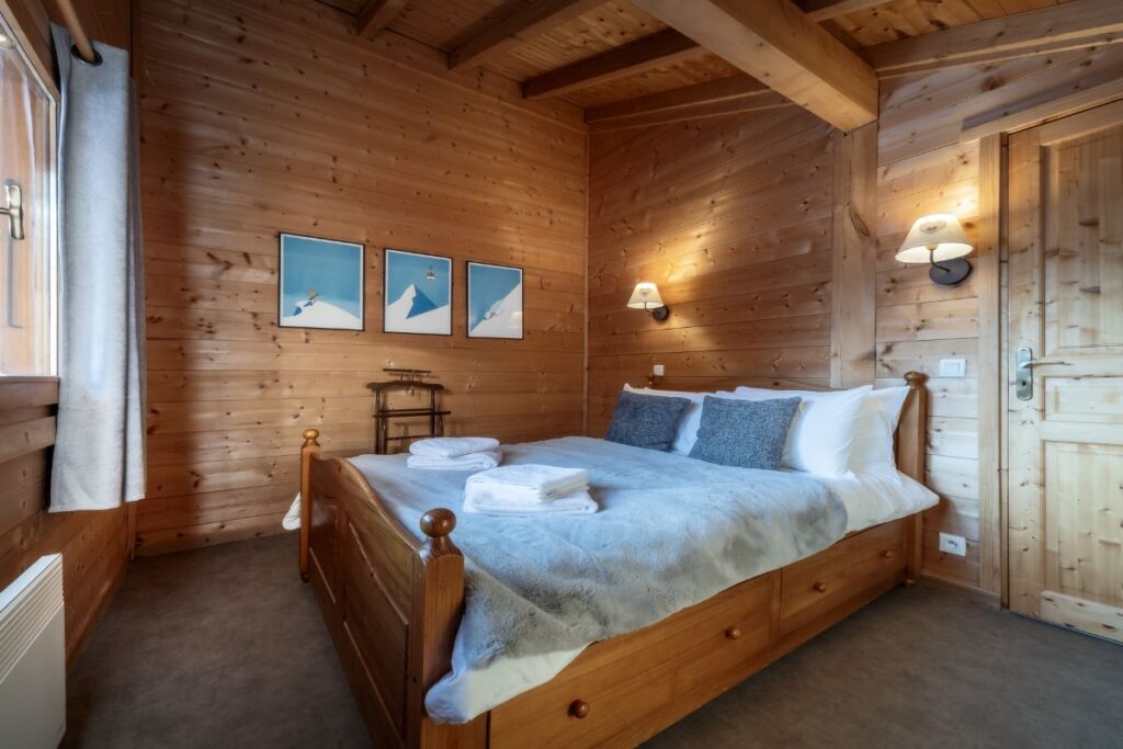 Room 1 Chalet Alba double bedroom with wooden interiors on the top floor