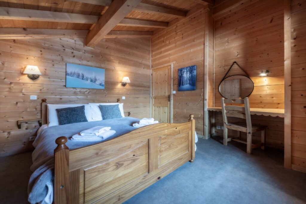 Room 2 Chalet Alba top-floor double bedroom with ensuite bathroom