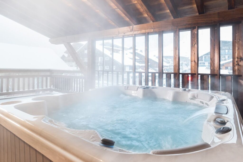 Colibri Penthouse Hot Tub Outdoor hot tub at the Colibri Penthouse in Morzine with mountain views