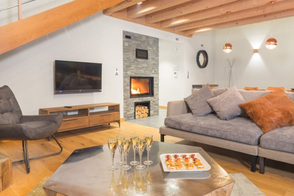 Colibri Penthouse Lounge Colibri Penthouse open-plan lounge with fireplace and contemporary furnishings