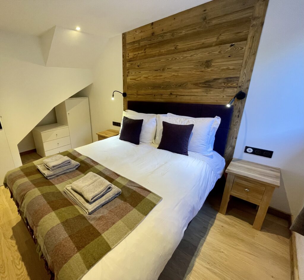 La Chaumine Bedroom Bedroom at La Chaumine with double bed and cosy alpine décor