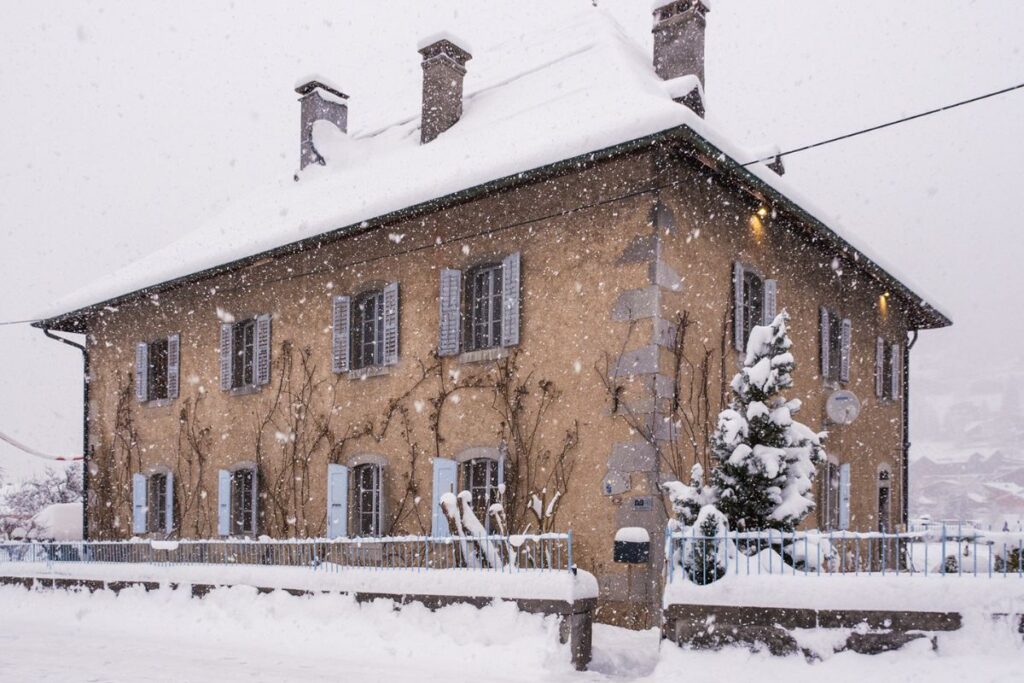 Le Manoir exterior snowing The Manoir Morzine in the snow