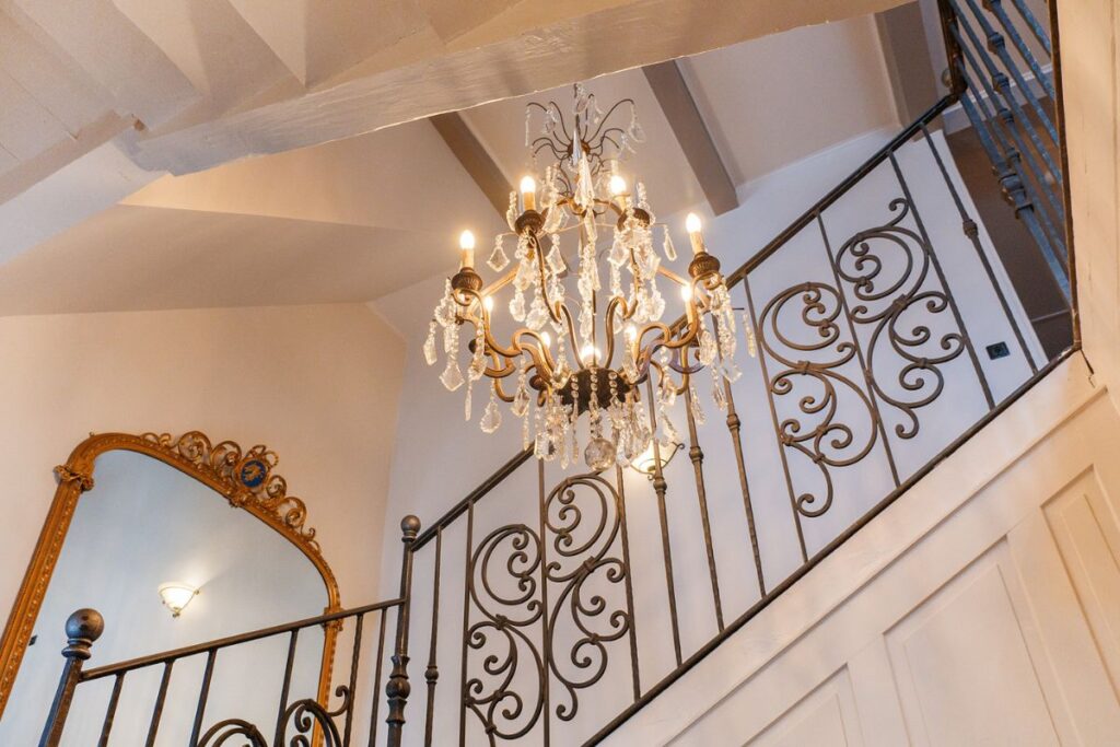 Le Manoir chandelier close up Chandelier lit staircase at the Manoir Morzine close up