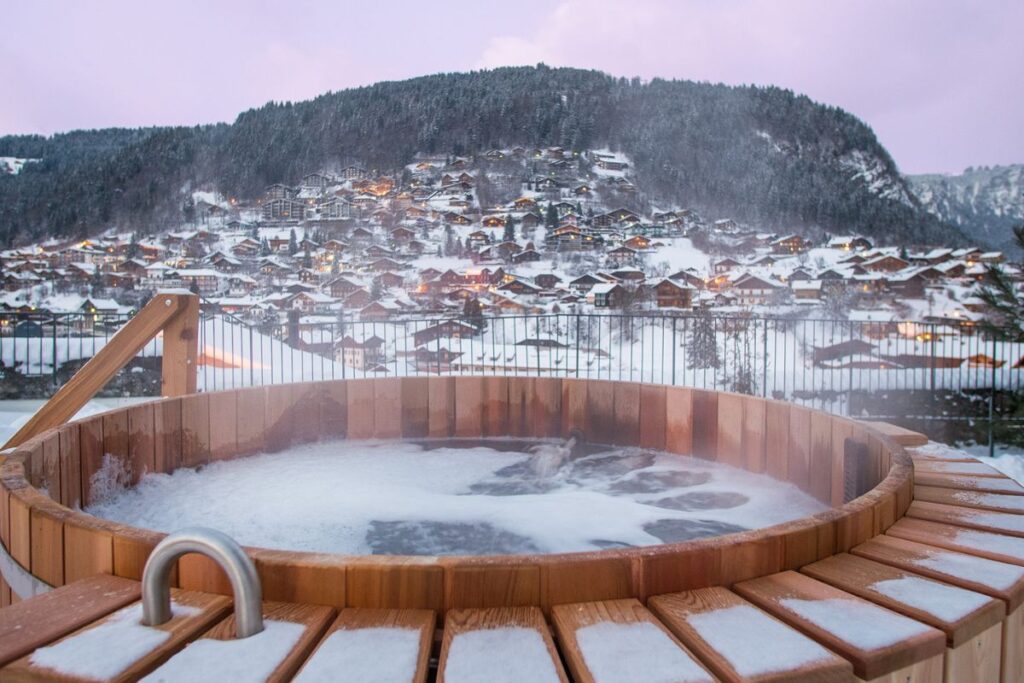Le Manoir Morzine Outdoor Hot Tub Le Manoir Morzine outdoor hot tub overlooking the snowy valley and village
