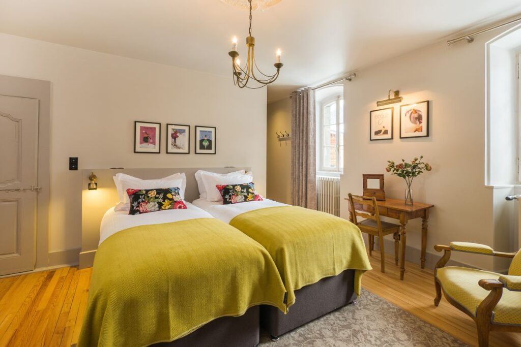 LLe Manoir Morzine Double Bedroome Manoir (32) Le Manoir Morzine spacious double bedroom with natural light and warm alpine décor