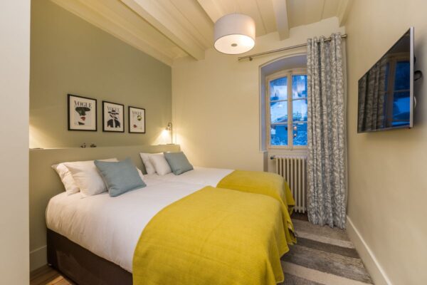 Bedroom with single or double bed at Le Manoir Morzine